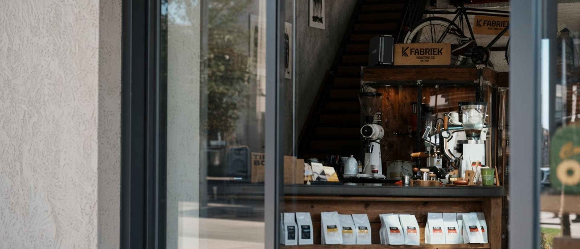 The FABRIEK shop through the glass, with the FABRIEK box above the counter